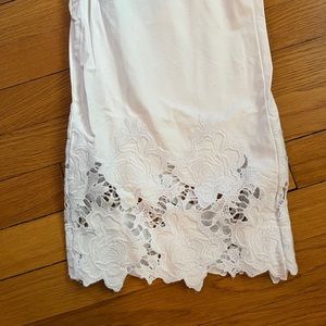 White ankle length pants with lace at bottom